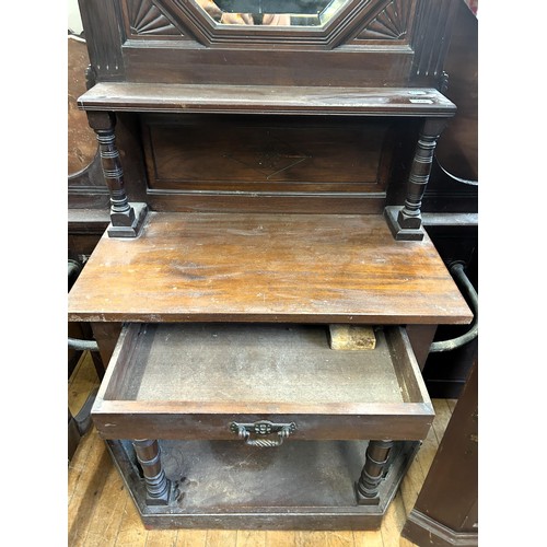 764 - A 19th century walnut hallstand, the back inset with a barometer and a mirror, 220 cm high x 100 cm ... 