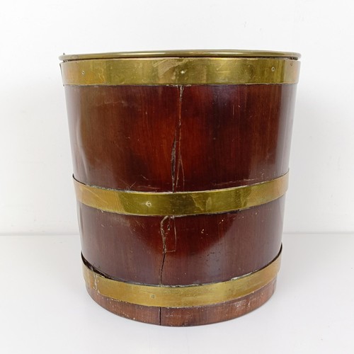 703 - A 19th century mahogany and brass bound bucket, with a ring handle, 50 cm high