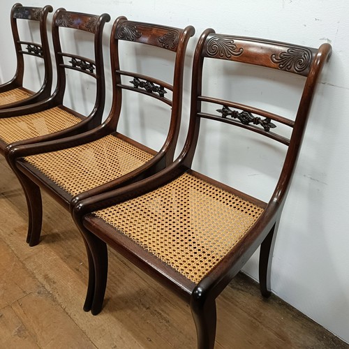 632 - A set of four Regency style bar back dining chairs, with carved top rails (4)