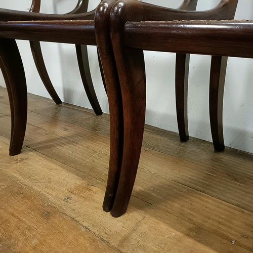 632 - A set of four Regency style bar back dining chairs, with carved top rails (4)