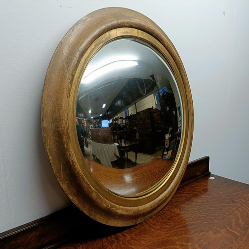 661 - An oak chest, 107 cm wide, three dining chairs and a convex wall mirror, 70 cm diameter, a mahogany ... 