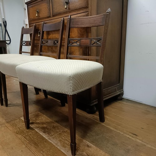 661 - An oak chest, 107 cm wide, three dining chairs and a convex wall mirror, 70 cm diameter, a mahogany ... 