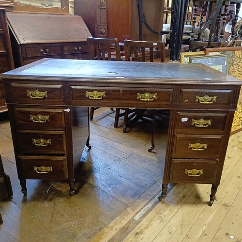 711 - An oak bookcase, 180 cm wide, a walnut desk, 120 cm wide, a stool, 108 cm wide, and a D-end dining t... 