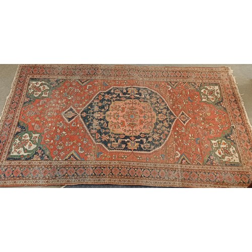 627 - A Tribal red ground rug, 230 x 160 cm