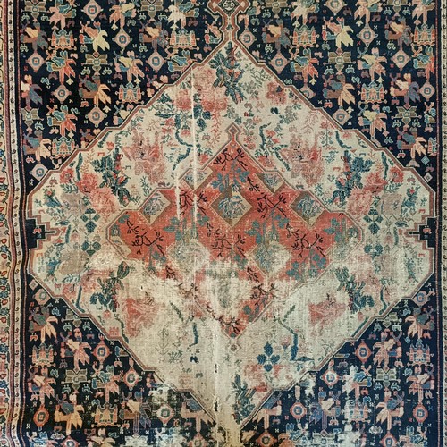 628 - A Persian blue ground rug, 220 x 130 cm