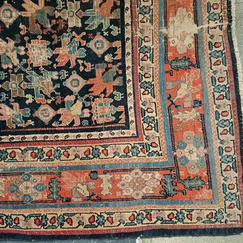 628 - A Persian blue ground rug, 220 x 130 cm