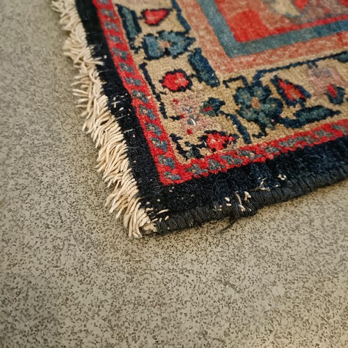 628 - A Persian blue ground rug, 220 x 130 cm