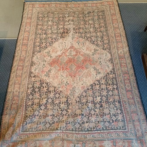 628 - A Persian blue ground rug, 220 x 130 cm