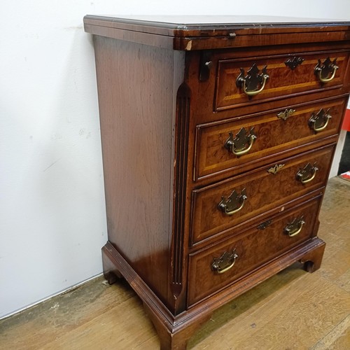 637 - A reproduction walnut Bachelors chest, 60 cm wide