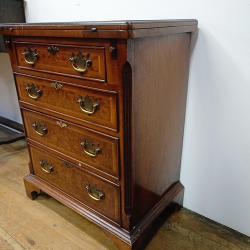 637 - A reproduction walnut Bachelors chest, 60 cm wide