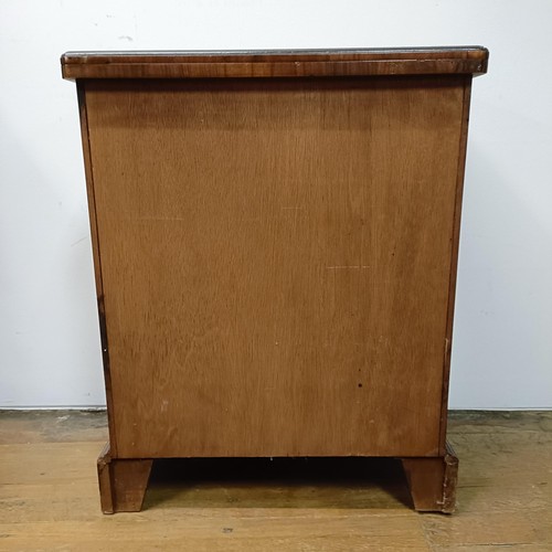 637 - A reproduction walnut Bachelors chest, 60 cm wide