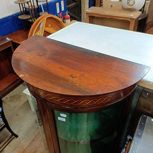 774 - An Edwardian mahogany bow front display cabinet, 77 cm wide