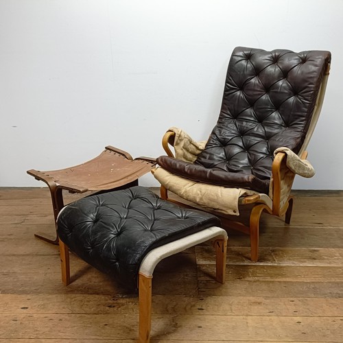 434 - A Bruno Mathsson Pernilla style bentwood armchair, with a leather button back and seat, a matching s... 