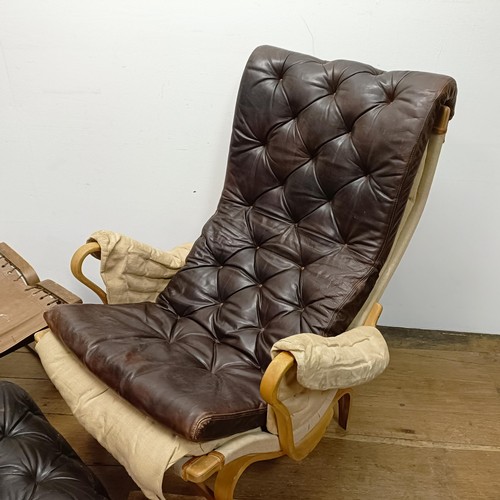 434 - A Bruno Mathsson Pernilla style bentwood armchair, with a leather button back and seat, a matching s... 