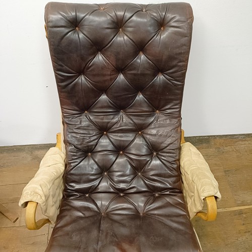 434 - A Bruno Mathsson Pernilla style bentwood armchair, with a leather button back and seat, a matching s... 