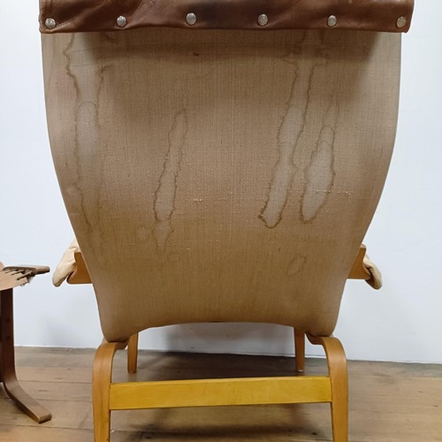 434 - A Bruno Mathsson Pernilla style bentwood armchair, with a leather button back and seat, a matching s... 