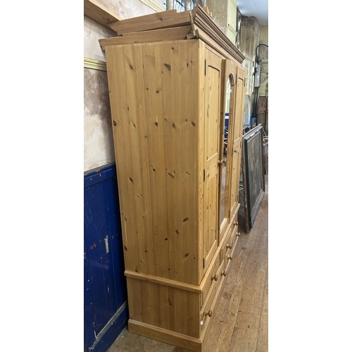 784 - A pine wardrobe, with a mirrored door, 145 cm wide