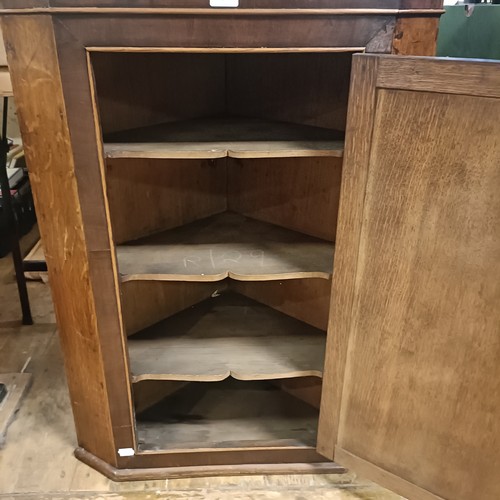 643 - An oak corner cabinet, 70 cm wide, two bookcases, a pair of bedside chests, and assorted other furni... 