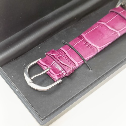 18 - A plum coloured Gossip wristwatch, with quartz movement, functioning and boxed