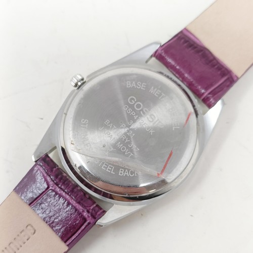 18 - A plum coloured Gossip wristwatch, with quartz movement, functioning and boxed