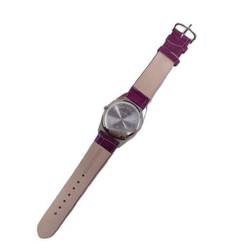 18 - A plum coloured Gossip wristwatch, with quartz movement, functioning and boxed