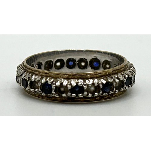 33 - A white stone and sapphire eternity ring, ring size N, in a modern ring box