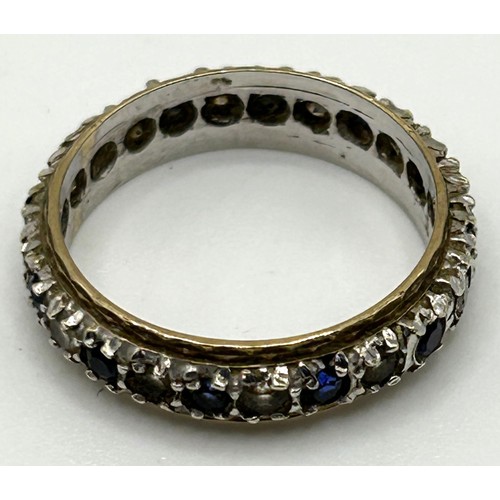 33 - A white stone and sapphire eternity ring, ring size N, in a modern ring box