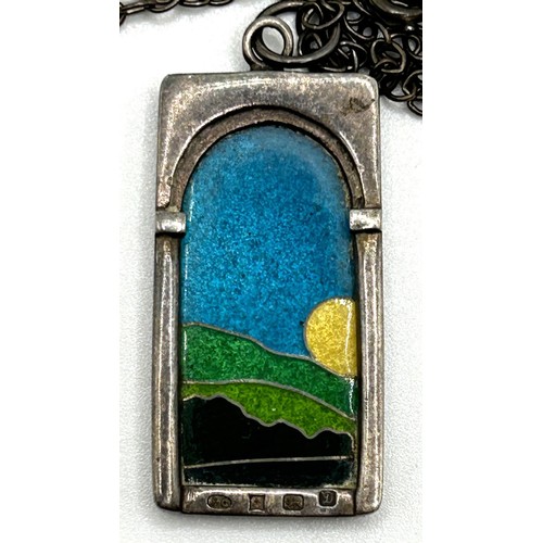 36 - A 20th century silver and enamel pendant, on a chain