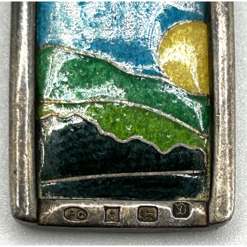 36 - A 20th century silver and enamel pendant, on a chain