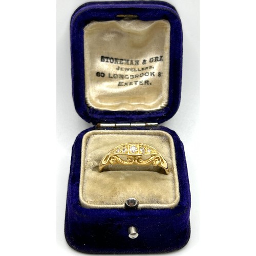 53 - An 18ct gold and three stone diamond ring, ring size Q, in a vintage jewellery box