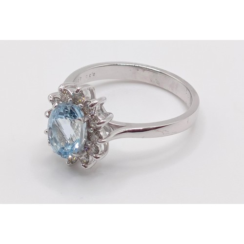 56 - A 18ct white gold, oval aquamarine and RBC diamond cluster ring, aquamarine 0.80ct, diamonds 0.30ct