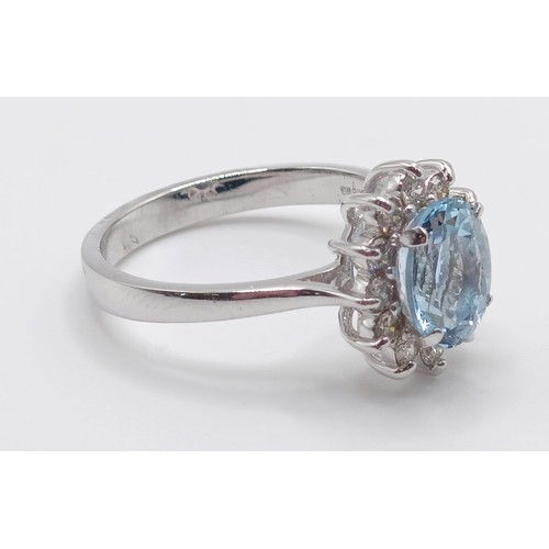 56 - A 18ct white gold, oval aquamarine and RBC diamond cluster ring, aquamarine 0.80ct, diamonds 0.30ct