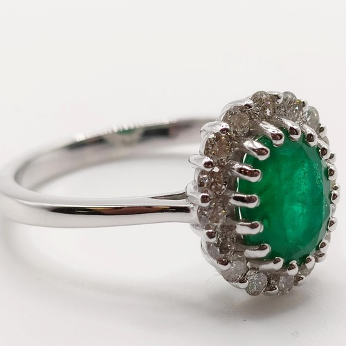 63 - An 18ct white gold, oval emerald and diamond cluster ring, emerald 1.31ct, RBC diamonds 0.37ct