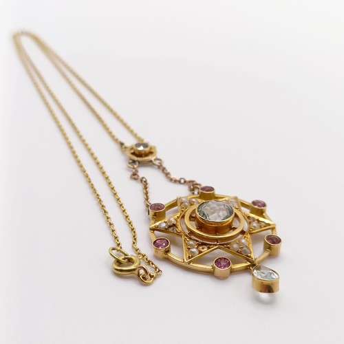 64 - A 15ct gold gem set pendant, on a chain