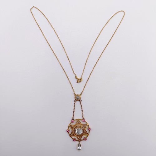 64 - A 15ct gold gem set pendant, on a chain