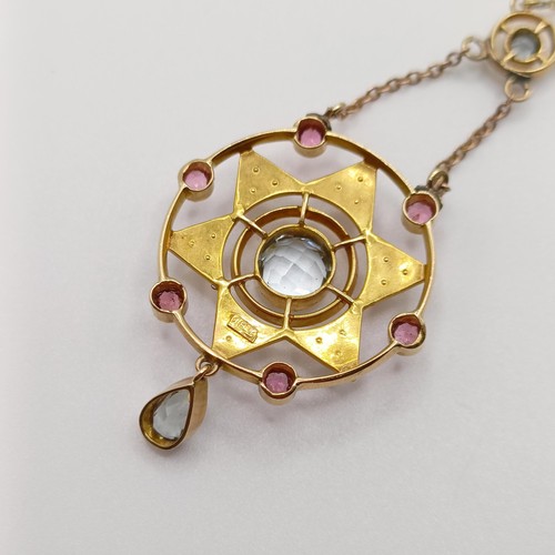 64 - A 15ct gold gem set pendant, on a chain