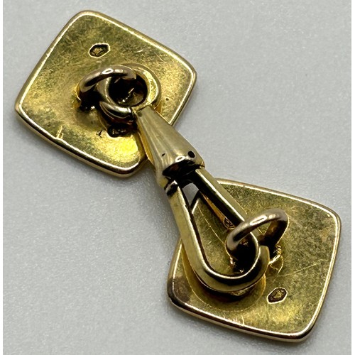 67 - A pair of 18ct gold and white enamel cufflinks, all in 11.9 g