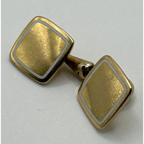 67 - A pair of 18ct gold and white enamel cufflinks, all in 11.9 g