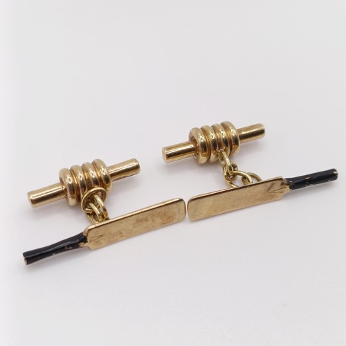 69 - A pair of 9ct gold and enamel novelty cufflinks, in the form of cricket bats and bails