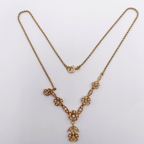 75 - An early 20th century 15ct gold and seed pearl floral necklace