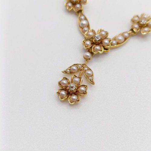 75 - An early 20th century 15ct gold and seed pearl floral necklace