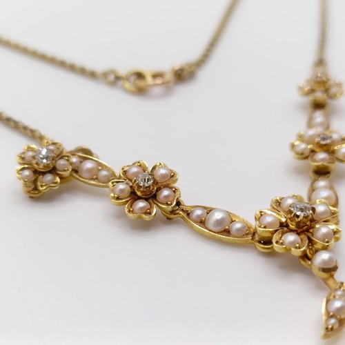 75 - An early 20th century 15ct gold and seed pearl floral necklace