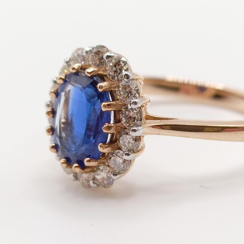 76 - A certificated 18ct rose gold, oval kyanite and diamond cluster ring, kyanite 1.42ct, diamonds 0.53c... 