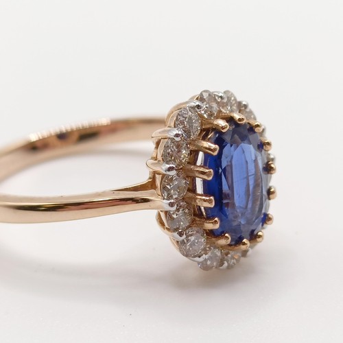 76 - A certificated 18ct rose gold, oval kyanite and diamond cluster ring, kyanite 1.42ct, diamonds 0.53c... 