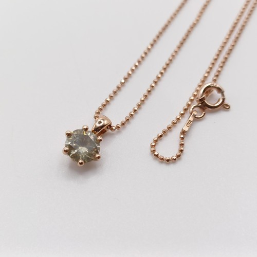 77 - A certificated 18ct rose gold and RBC diamond solitaire pendant, on a rose gold-plated silver chain,... 