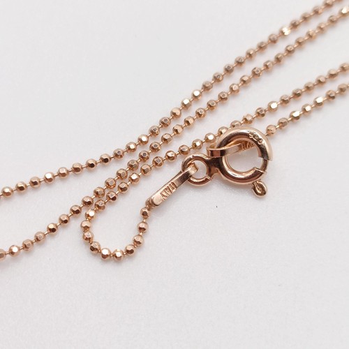 77 - A certificated 18ct rose gold and RBC diamond solitaire pendant, on a rose gold-plated silver chain,... 