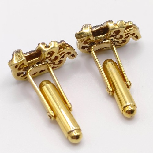 91 - A pair of gold plated silver elephant cufflinks, set with rose-cut diamonds and ruby eyes, diamonds ... 