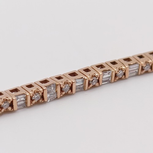 107 - An unusual 10ct rose gold bracelet, set with baguette and RBC diamonds, with an open box clasp and s... 