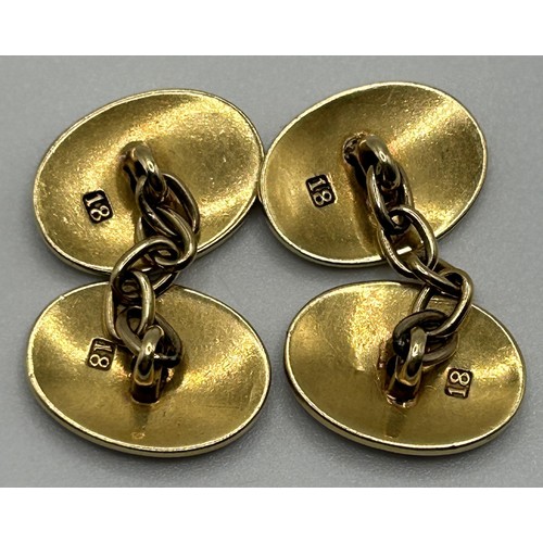 111 - A pair of 18ct gold, enamel and diamond set cufflinks, of oval form, having chain connectors, 11 g (... 