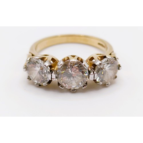 116 - A 9ct yellow gold and cubic zirconia set trilogy ring, CZs 5.78 ct approx